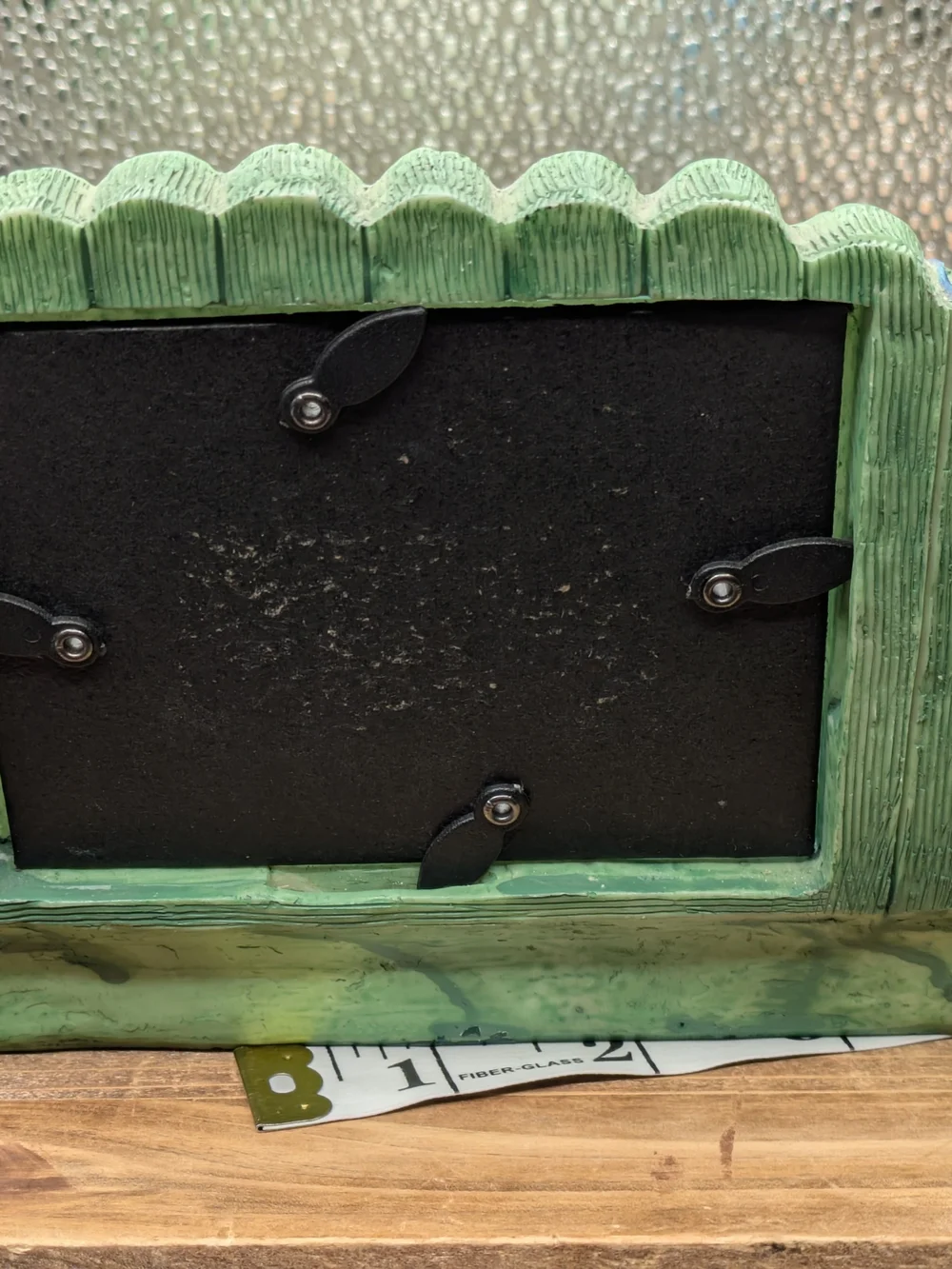 Green Wooden Bench Picture Frame with Hat and Potted Flowers